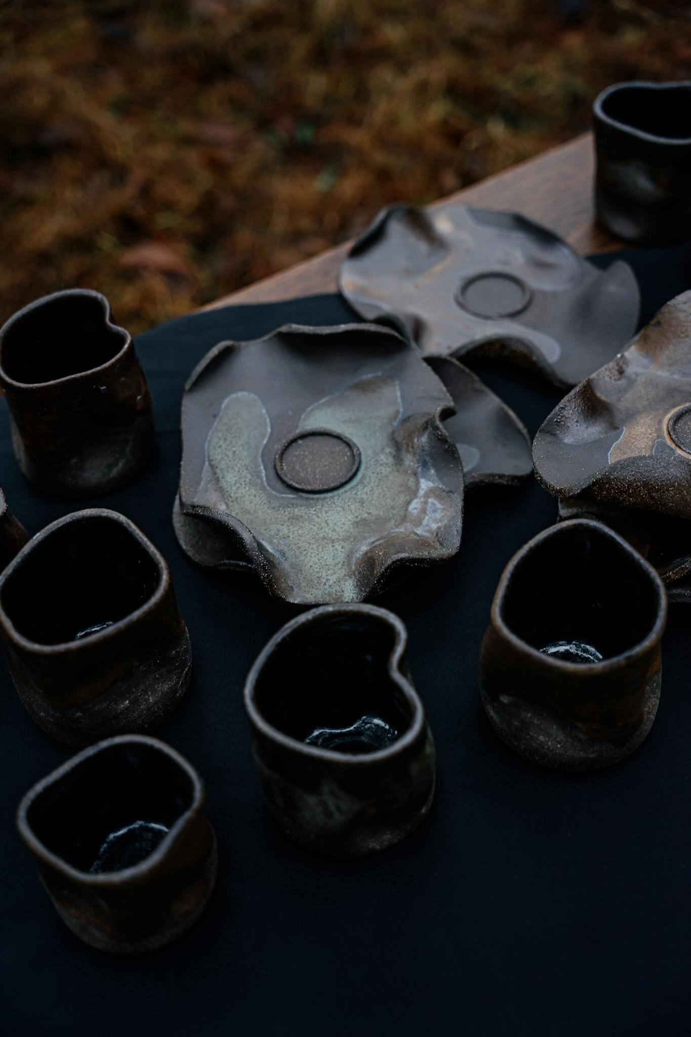 Discover a collection of rustic handmade pottery with unique textures and earthy tones.